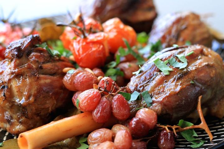 Lamb shanks with pomegranate and lemon (close up of sticky roasted shank)
