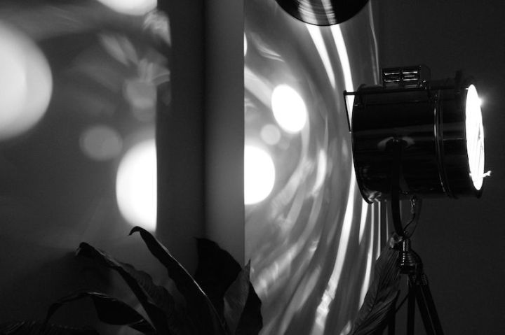 Shadows on the wall made by a large marine lamp