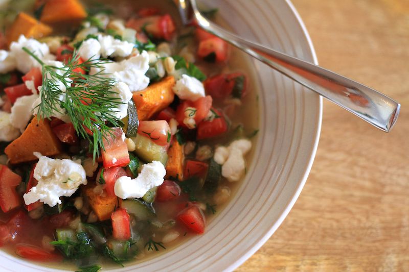 Spring soup - finished with fresh parsley and dill and topped with chèvre