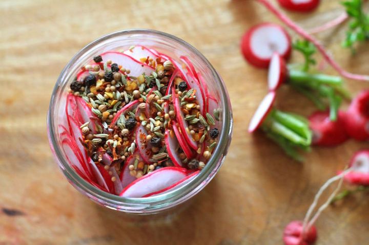Radishes layered with peppercorns, fennel, mustard, coriander and chilli