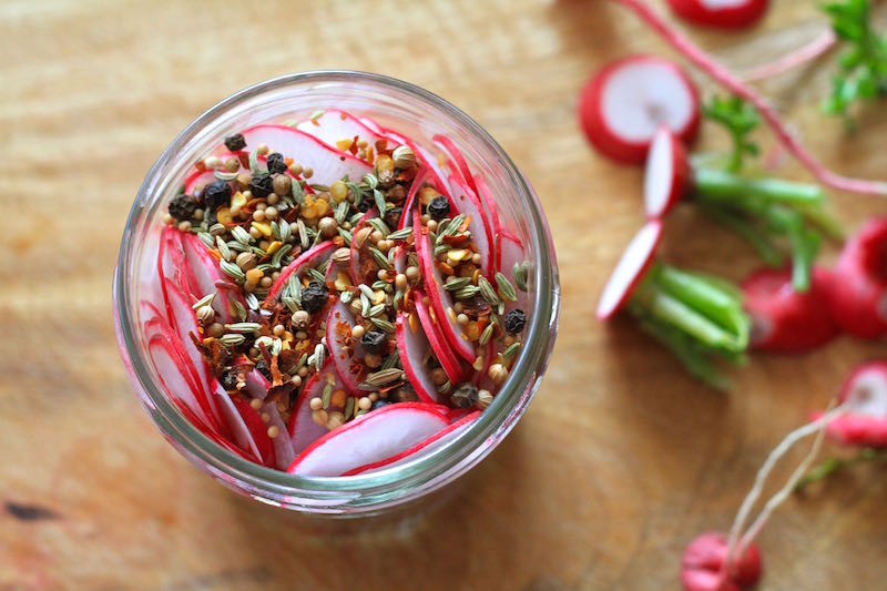 Radishes layered with peppercorns, fennel, mustard, coriander and chilli