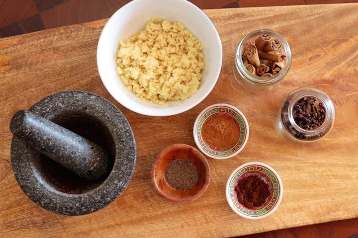 Grinding spices for fresh ginger cake