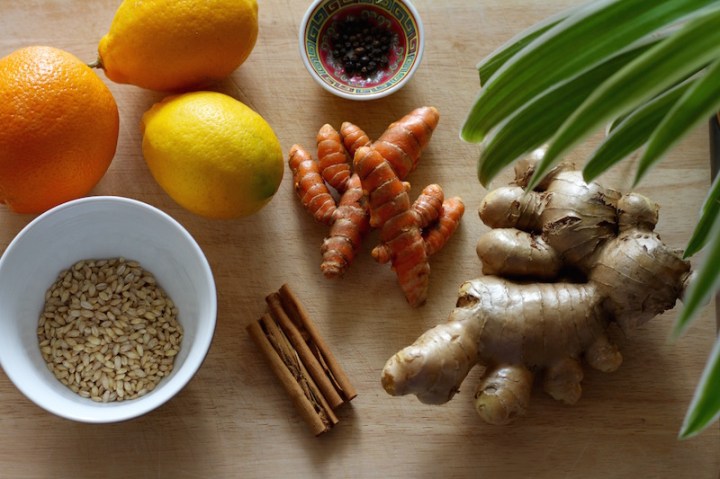 Making Under the Weather Tea - homemade flu remedy with fresh ginger, turmeric and barley