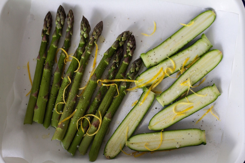 Roasting asparagus and courgettes with lemon zest