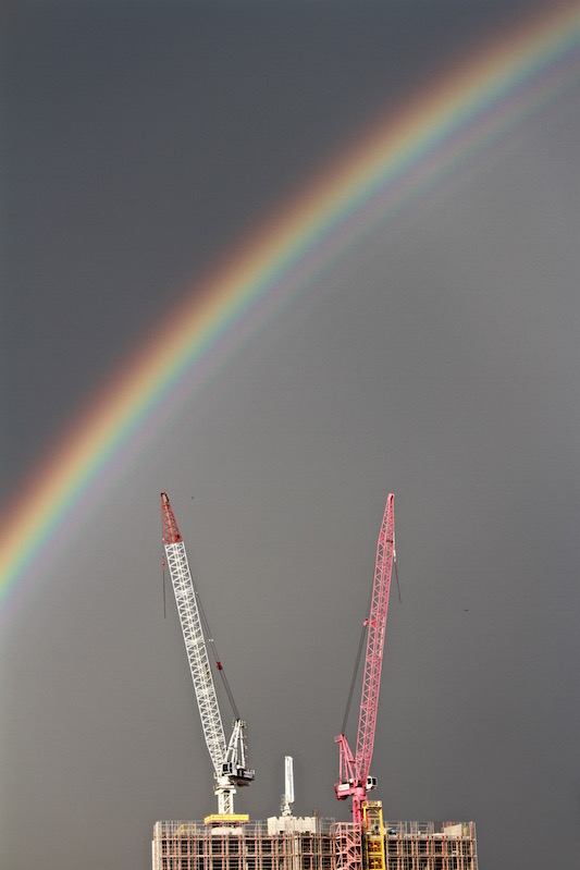 Stormy sky, rainbow and cranes in Brisbane Australia, 2013