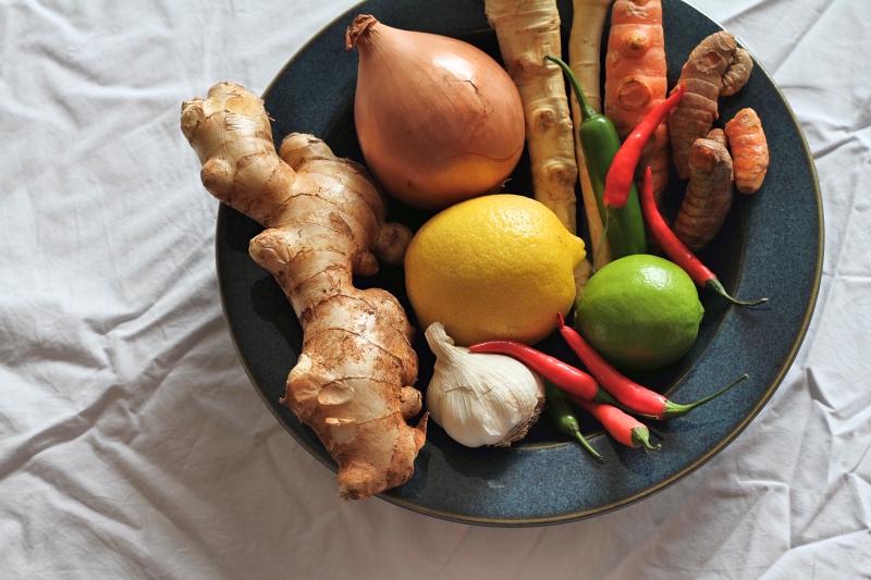 Fresh horseradish, ginger, chilli, turmeric, onions and citrus - ingredients for Fire Cider